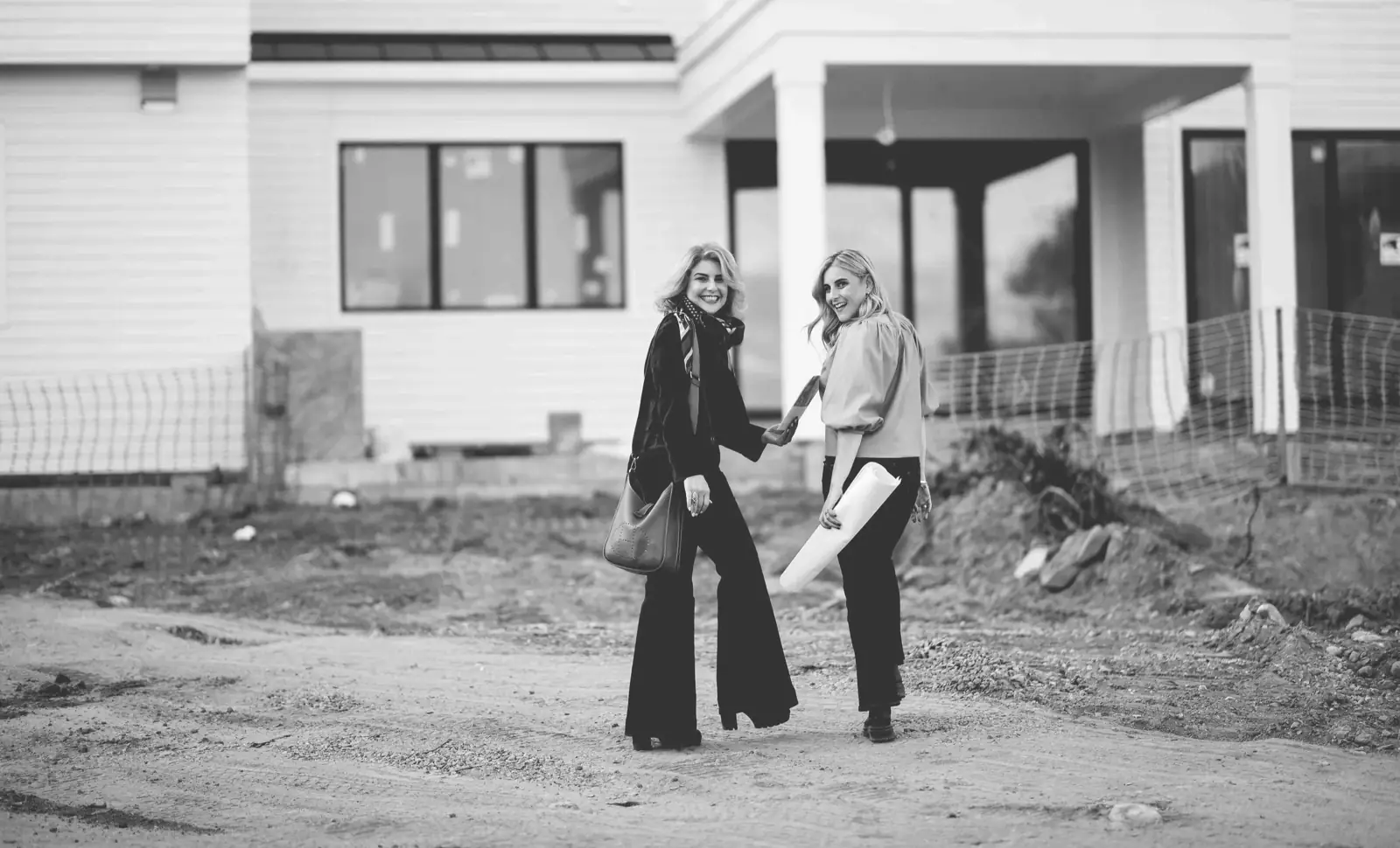 Angela Retelny and Jessica Retelny Shames in front of a Scarsdale home